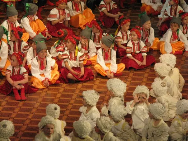 Costumed child performers of Veseli Cherevychky seated together before a show